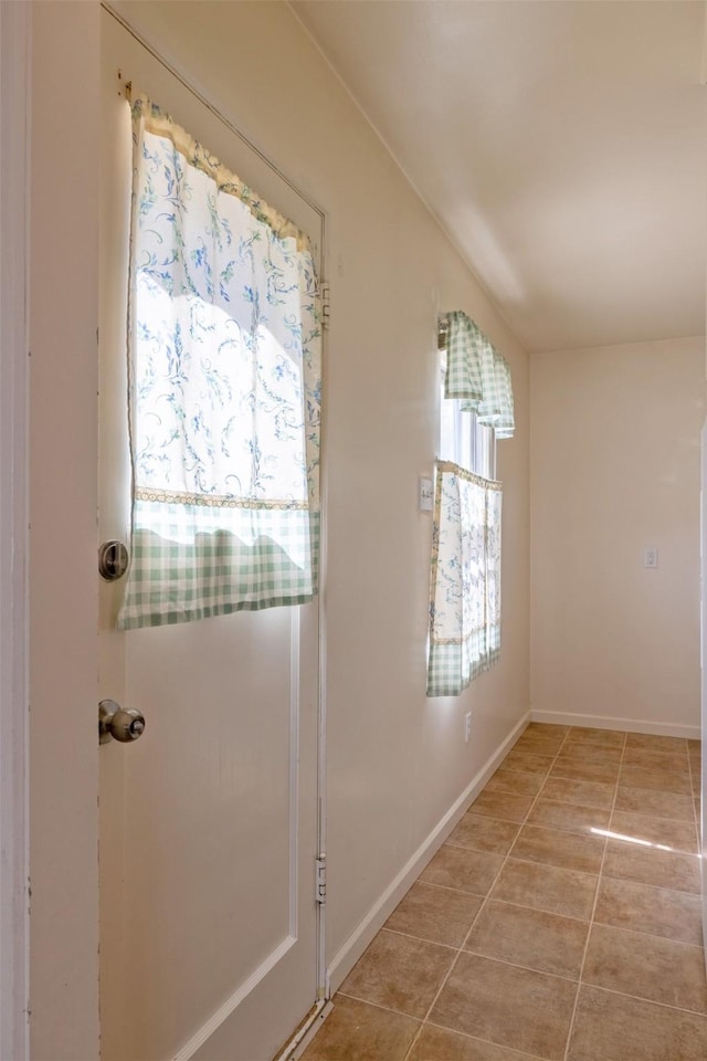 925 Hollins Ave, Helena, MT 59601 - doorway featuring light tile patterned floors and baseboards