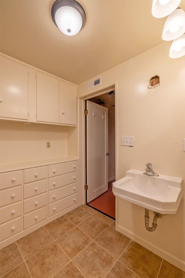 925 Hollins Ave, Helena, MT 59601 - bathroom featuring tile patterned flooring and a sink