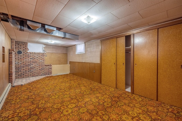 925 Hollins Ave, Helena, MT 59601 - basement featuring a baseboard radiator and wood walls