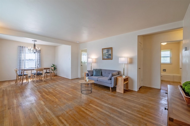 925 Hollins Ave, Helena, MT 59601 - living room with light wood-style flooring and a chandelier