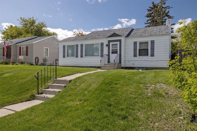 925 Hollins Ave, Helena, MT 59601 - view of front of home featuring a front yard, a chimney, and a shingled roof