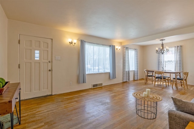 925 Hollins Ave, Helena, MT 59601 - living room featuring a chandelier and wood finished floors