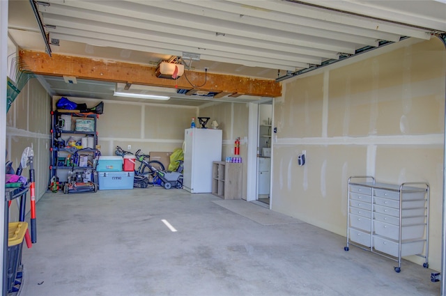 1320 Flowerree St, Helena, MT 59601 - garage with freestanding refrigerator and a garage door opener