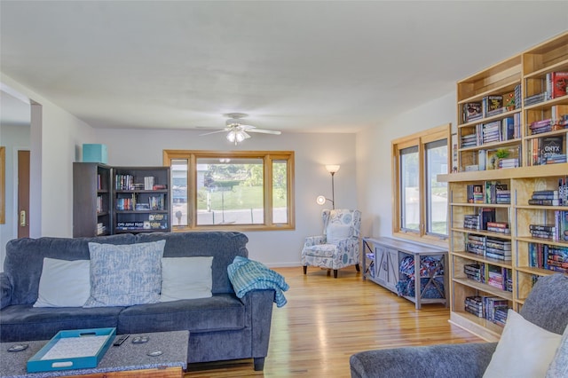 1320 Flowerree St, Helena, MT 59601 - living room with wood finished floors, a ceiling fan, and baseboards