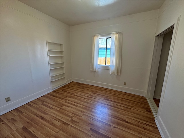 108 Meany St, Plains, MT 59859 - empty room with wood finished floors and baseboards
