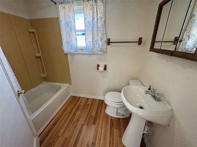 108 Meany St, Plains, MT 59859 - full bathroom featuring wood finished floors and washtub / shower combination
