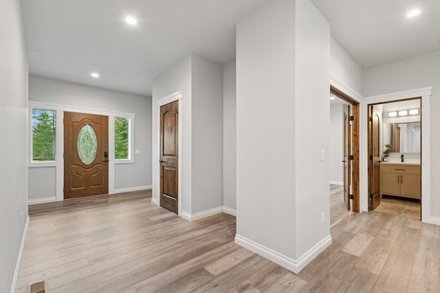 323 Skookum Rd, Lakeside, MT 59922 - entryway featuring light wood-style floors, baseboards, and recessed lighting