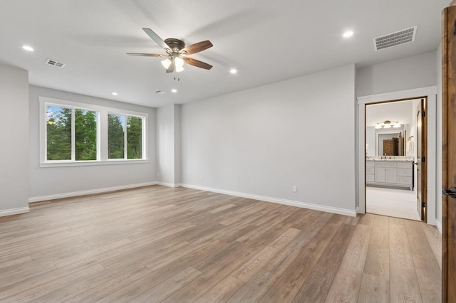 323 Skookum Rd, Lakeside, MT 59922 - unfurnished room featuring ceiling fan, light wood finished floors, and recessed lighting