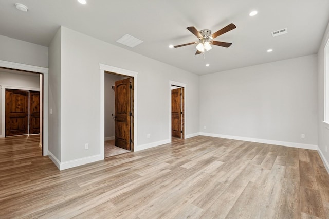 323 Skookum Rd, Lakeside, MT 59922 - unfurnished bedroom featuring a spacious closet, light wood-style flooring, recessed lighting, baseboards, and a closet