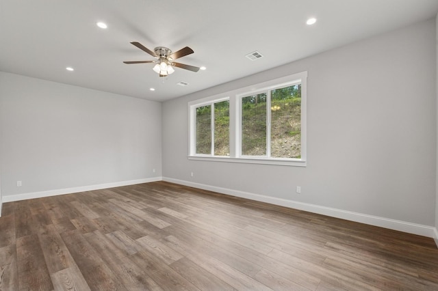 323 Skookum Rd, Lakeside, MT 59922 - unfurnished room with ceiling fan, recessed lighting, and wood finished floors