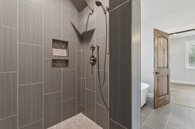 323 Skookum Rd, Lakeside, MT 59922 - bathroom with tiled shower and a freestanding tub