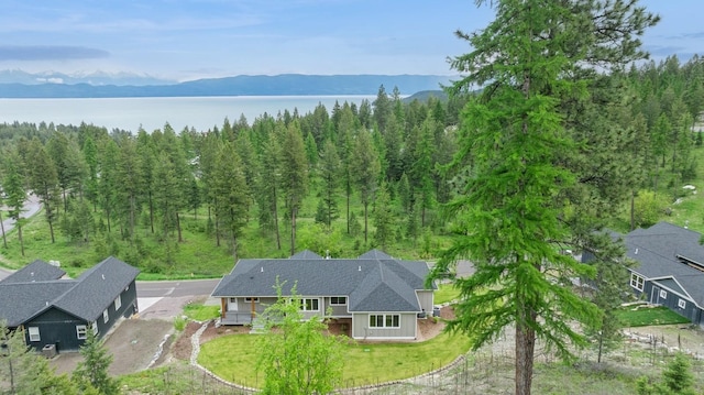 323 Skookum Rd, Lakeside, MT 59922 - view of subject property with a water and mountain view and a heavily wooded area