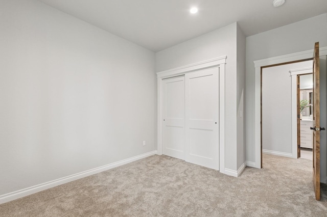 323 Skookum Rd, Lakeside, MT 59922 - unfurnished bedroom featuring carpet flooring, baseboards, and a closet