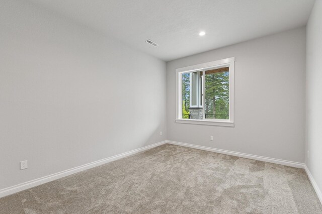 323 Skookum Rd, Lakeside, MT 59922 - carpeted empty room with baseboards and recessed lighting