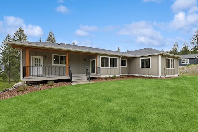323 Skookum Rd, Lakeside, MT 59922 - back of property with a yard, a porch, and board and batten siding
