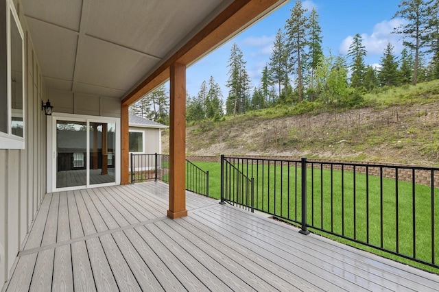 323 Skookum Rd, Lakeside, MT 59922 - wooden deck featuring a lawn