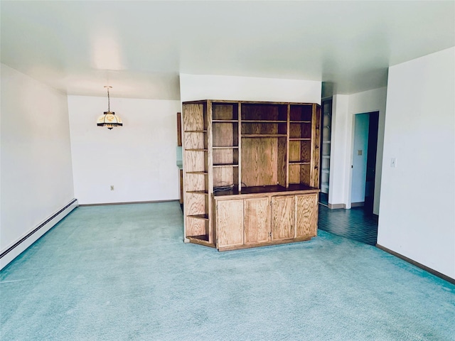 951 Ronald Ave Unit 410, Missoula, MT 59801 - unfurnished living room with carpet floors and a baseboard heating unit