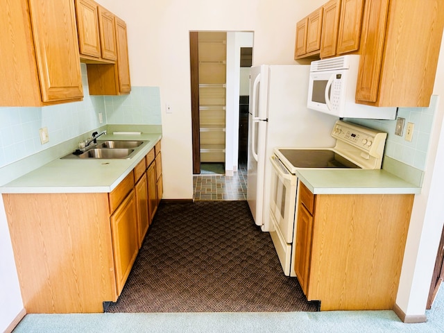 951 Ronald Ave Unit 410, Missoula, MT 59801 - kitchen with white appliances, carpet floors, light countertops, and decorative backsplash