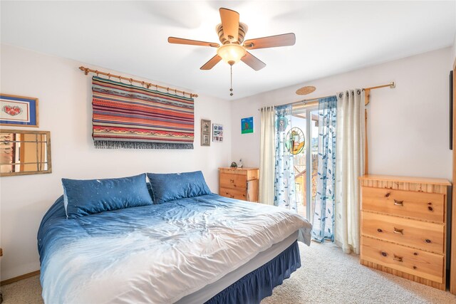 158 Parkside Dr, Kalispell, MT 59901 - bedroom featuring access to exterior, carpet floors, and a ceiling fan