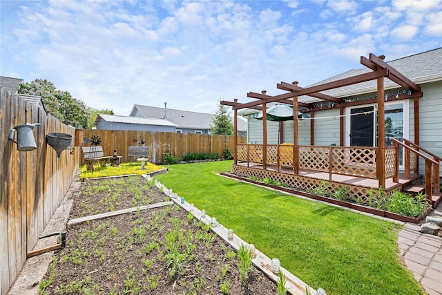 158 Parkside Dr, Kalispell, MT 59901 - view of yard with a vegetable garden, a pergola, and a deck