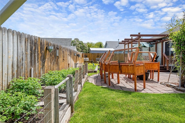 158 Parkside Dr, Kalispell, MT 59901 - view of yard with a vegetable garden, a patio area, a pergola, and a wooden deck