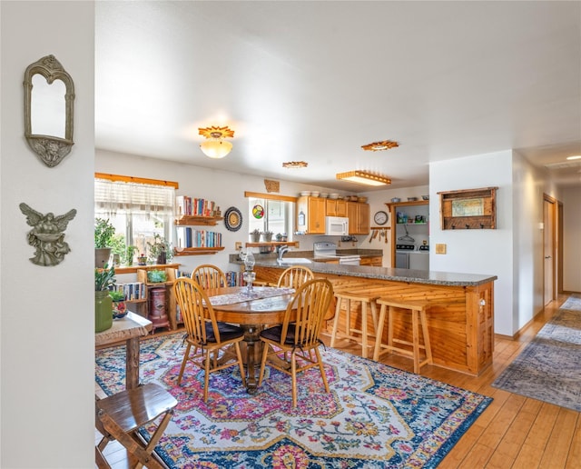 158 Parkside Dr, Kalispell, MT 59901 - dining area with light wood-style floors and independent washer and dryer