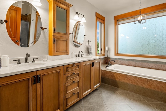 36665 Highland Ct, Polson, MT 59860 - bathroom featuring double vanity, a garden tub, and tile patterned flooring