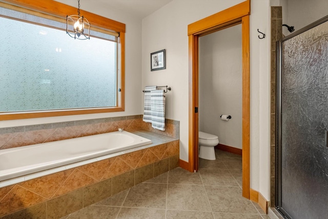 36665 Highland Ct, Polson, MT 59860 - bathroom featuring a bath, toilet, a stall shower, tile patterned floors, and baseboards