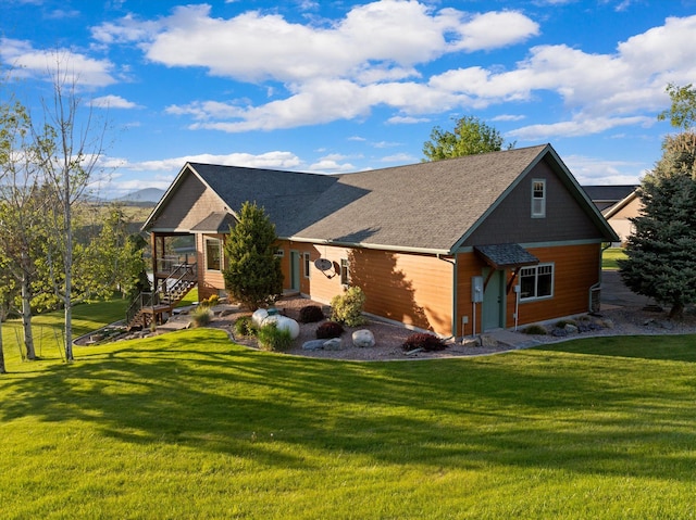 36665 Highland Ct, Polson, MT 59860 - view of front of property with a front yard and stairs