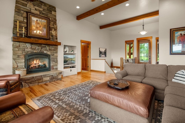 36665 Highland Ct, Polson, MT 59860 - living room featuring light wood finished floors, beam ceiling, recessed lighting, a fireplace, and baseboards