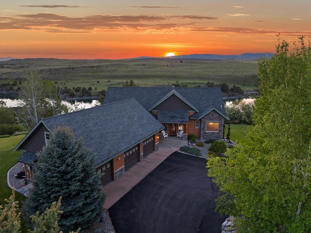 36665 Highland Ct, Polson, MT 59860 - aerial view of property and surrounding area with a mountainous background