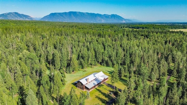 380 Haskill Basin Rd, Whitefish, MT 59937 - view from above of property with a heavily wooded area and a mountain backdrop