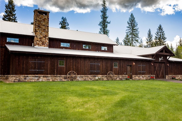 380 Haskill Basin Rd, Whitefish, MT 59937 - rear view of property with a chimney and a yard