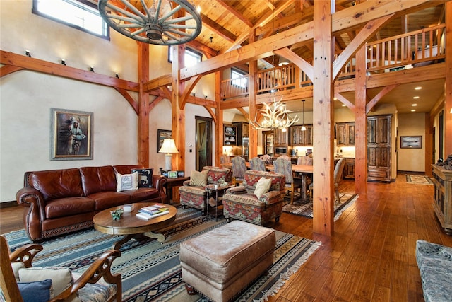 380 Haskill Basin Rd, Whitefish, MT 59937 - living room featuring a chandelier, high vaulted ceiling, hardwood / wood-style floors, and a wooden ceiling with exposed beams