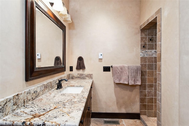 380 Haskill Basin Rd, Whitefish, MT 59937 - full bathroom featuring a tile shower and vanity