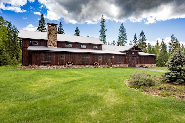 380 Haskill Basin Rd, Whitefish, MT 59937 - rear view of house with a yard and a chimney