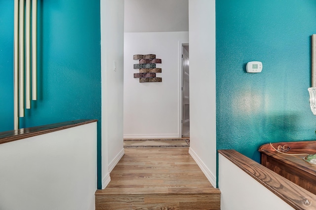 1502 Hauser Blvd, Helena, MT 59601 - hallway with light wood-style floors and baseboards