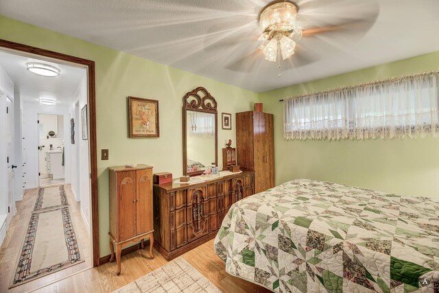 1502 Hauser Blvd, Helena, MT 59601 - bedroom with wood finished floors, baseboards, and a ceiling fan