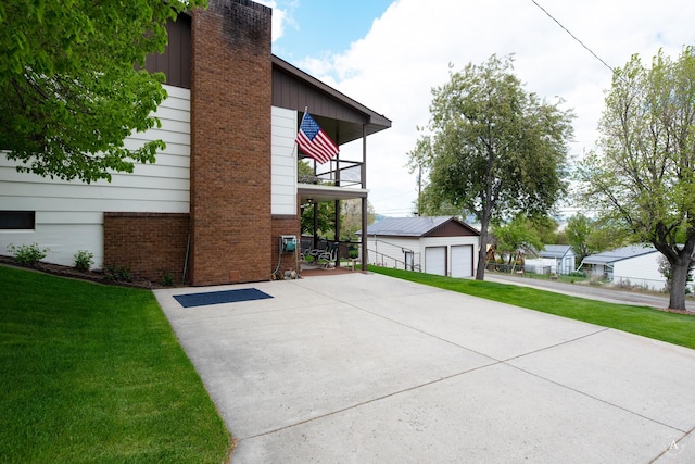 1502 Hauser Blvd, Helena, MT 59601 - view of side of property featuring a balcony, an outbuilding, a lawn, and a detached garage