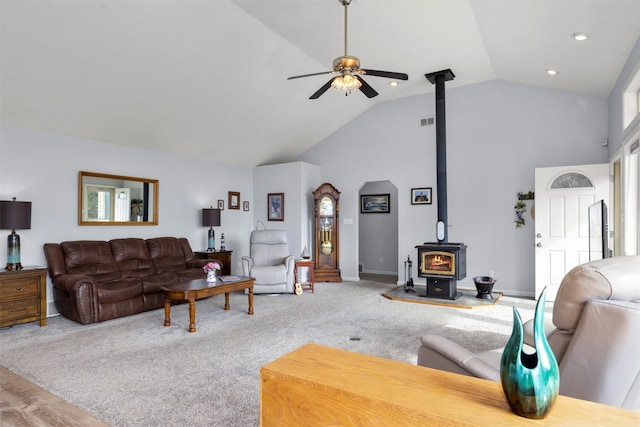 100 Rimini Rd, Lakeside, MT 59922 - living room with a wood stove, a ceiling fan, high vaulted ceiling, carpet floors, and recessed lighting