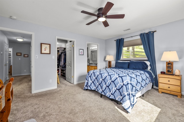 100 Rimini Rd, Lakeside, MT 59922 - bedroom featuring carpet floors, a walk in closet, a closet, and baseboards