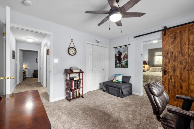 100 Rimini Rd, Lakeside, MT 59922 - carpeted office with ceiling fan, a barn door, and baseboards