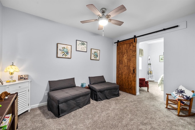 100 Rimini Rd, Lakeside, MT 59922 - living area with a ceiling fan, carpet, and a barn door