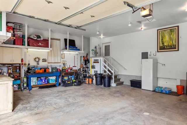 100 Rimini Rd, Lakeside, MT 59922 - garage featuring a workshop area and a garage door opener