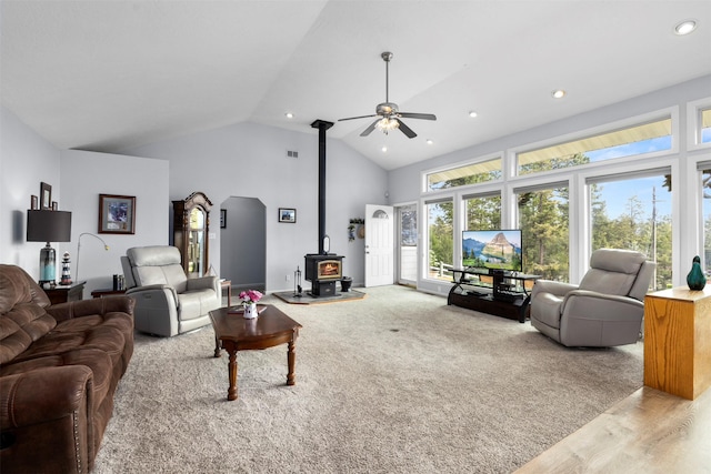 100 Rimini Rd, Lakeside, MT 59922 - living area featuring a wood stove, ceiling fan, recessed lighting, and high vaulted ceiling
