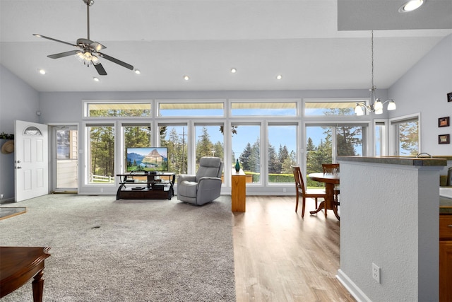100 Rimini Rd, Lakeside, MT 59922 - living room featuring recessed lighting, a ceiling fan, a chandelier, light wood-style floors, and high vaulted ceiling