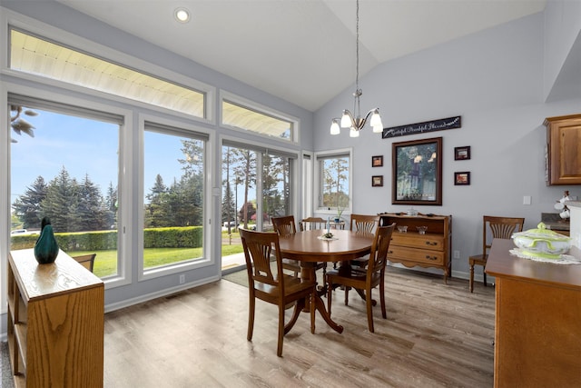 100 Rimini Rd, Lakeside, MT 59922 - dining space with vaulted ceiling, light wood-type flooring, a chandelier, baseboards, and recessed lighting