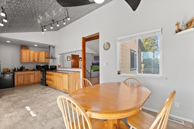 1509 Eagle Dr, Kalispell, MT 59901 - dining space with high vaulted ceiling and track lighting
