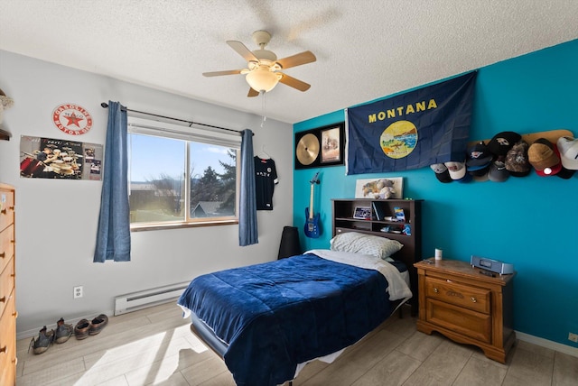 1509 Eagle Dr, Kalispell, MT 59901 - bedroom featuring a baseboard radiator, a textured ceiling, a ceiling fan, and wood finished floors