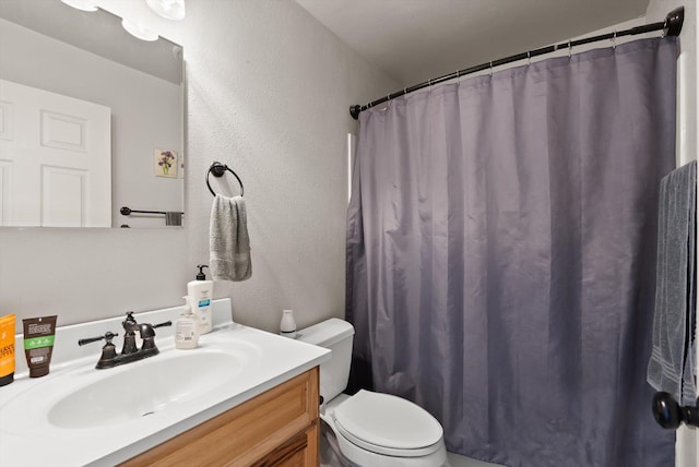 1509 Eagle Dr, Kalispell, MT 59901 - full bath with toilet, vanity, a textured wall, and a shower with curtain